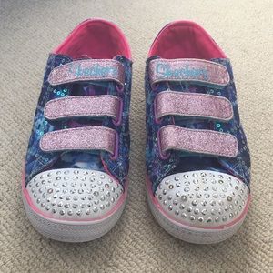 Skechers Twinkle Toes light up shoes.
